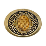 Decorative button with gold and black design on a white background