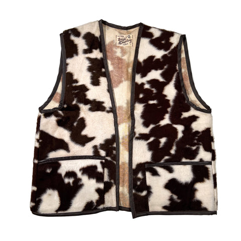 Cow print vest on a white background