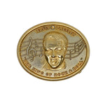 Gold coin featuring Elvis Presley's face with musical notes on a white background