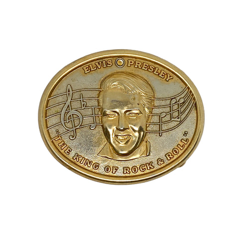 Gold coin featuring Elvis Presley's face with musical notes on a white background