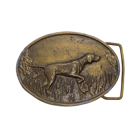 Bronze belt buckle with a hunting dog design on a white background