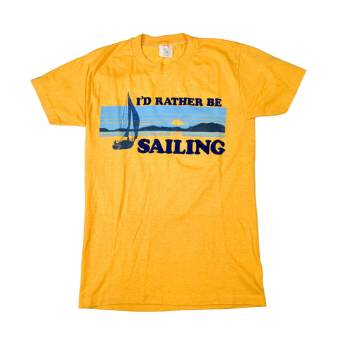 Yellow t-shirt with 'I'd Rather Be Sailing' graphic on a white background