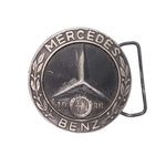 Mercedes-Benz belt buckle with star emblem and '1936' on a white background