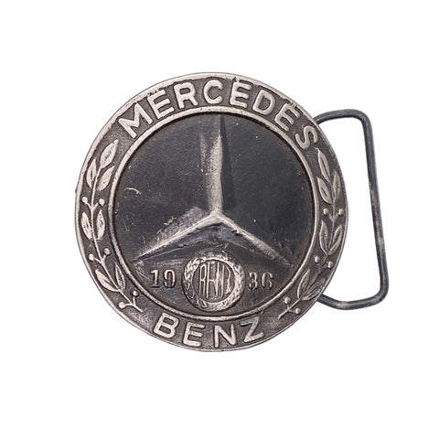 Mercedes-Benz belt buckle with star emblem and '1936' on a white background