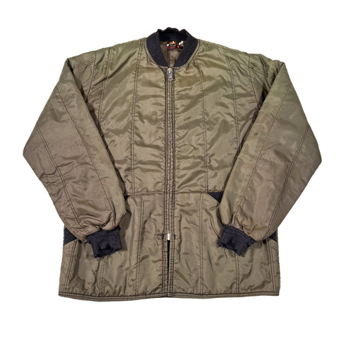 Green jacket with black cuffs on a white background