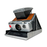 Vintage Polaroid camera on a white background