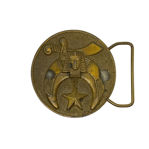 Bronze belt buckle with pharaoh design on a white background