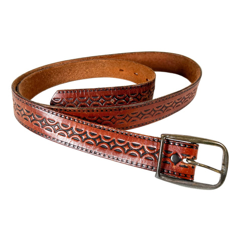 Brown leather belt with intricate embossing on a white background