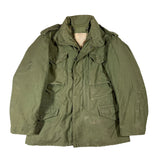 Green military-style jacket on a white background