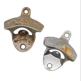 Two vintage metal bottle openers on a white textured background, one showing engraved text and significant rust, and the other showing a yellowed, worn section.
