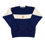 Navy sweater with cream collar and cuffs on a white background