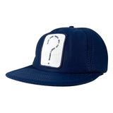 A navy blue flat-brim cap with a white rectangular patch on the front featuring a black question mark and text, photographed on a light gray studio background.