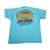 Blue t-shirt with a graphic of a car and cacti, and text 'I Brake for Nothing!' on a white background.