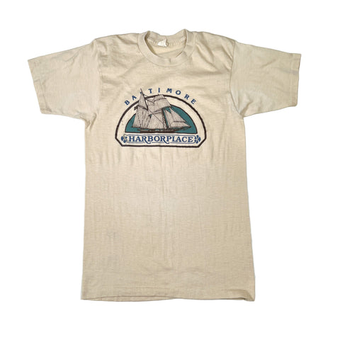 Beige t-shirt with a graphic design on a white background