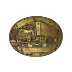 Bronze belt buckle with truck design on a white background