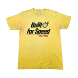 Yellow t-shirt with 'Built for Speed' text on a white background