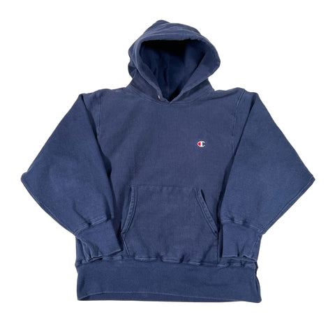 Blue hoodie with a small logo on the chest against a white background