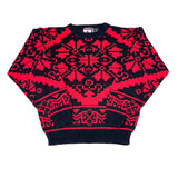 Red and black patterned harem pants on a white background