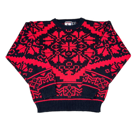 Red and black patterned harem pants on a white background