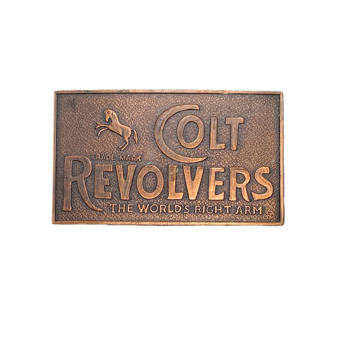 Bronze belt buckle with 'Colt Revolvers' text and horse logo on a white background