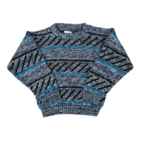Blue and gray patterned sweater on a white background