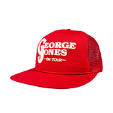 Red cap with 'George Jones On Tour' text on a white background