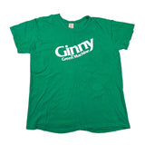 A green short-sleeve t-shirt with 'Ginny the Green Machine' printed in white across the chest, laid flat on a white background.