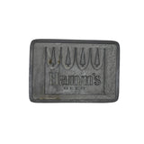 Rectangular metal object with 'Hamm's Beer' branding on a white background