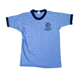 Blue t-shirt with black collar and logo on a white background