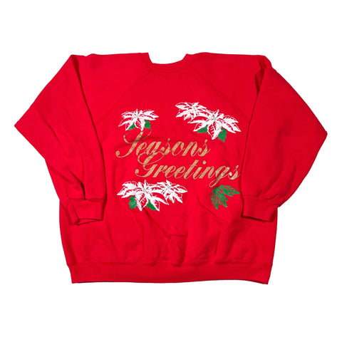 Red shorts with floral and text design on a white background