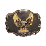 Belt buckle with gold eagle design on a white background