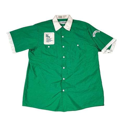Green shirt with white collar and buttons on a white background