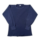 A dark navy blue ribbed waffle-knit long-sleeve crewneck sweater laid flat on a white background.