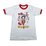A white ringer t-shirt with red trim on the collar and cuffs, featuring a colorful graphic print of a basketball player with the text 'DR. "I" prescription WORKS!'.