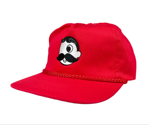 Red cap with a cartoon character design on a white background