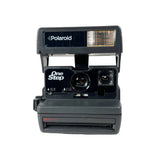 Black Polaroid OneStep camera on a white background