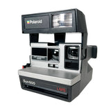 Polaroid Sun 600 instant camera on a white background