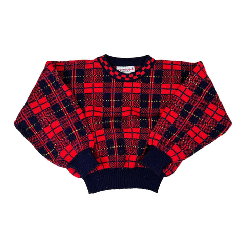 Red and black plaid sweater on a white background