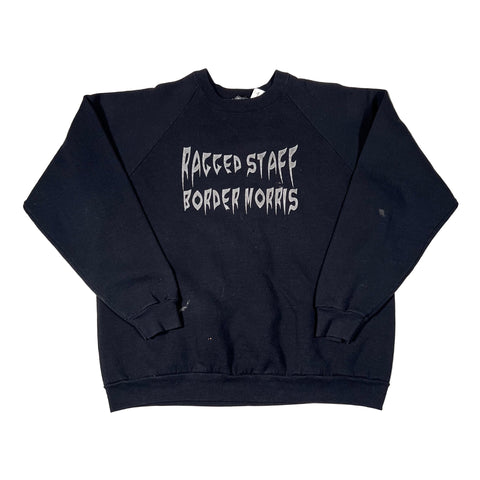 Black sleeveless shirt with white text on a white background