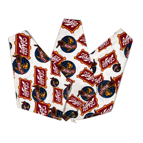 Neck gaiter with Schlitz beer logo pattern on a white background