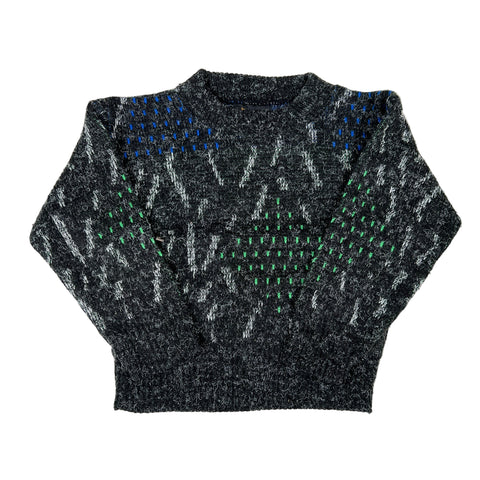 Black knit sweater with green and blue pattern on a white background
