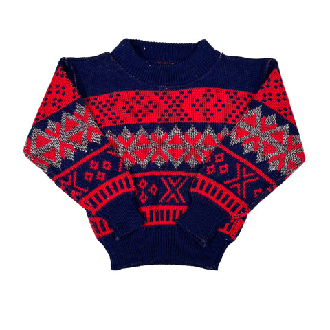 Navy and red patterned sweater on a white background
