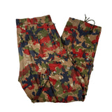 Folded camouflage pants on a white background