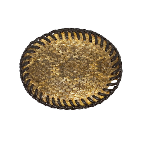 Round woven object with a textured surface on a white background