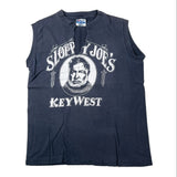 A sleeveless dark navy blue tunic shirt with a white graphic print of a bearded man and the text 'Sloppy Joe's Key West' on the front, laid flat on a light background.