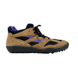 Brown and black sneaker with purple accents on a white background
