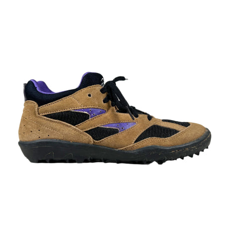 Brown and black sneaker with purple accents on a white background