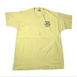 A pale yellow short-sleeve t-shirt laid flat on a white surface, featuring a dark green graphic on the left chest that reads 'AWFUL ARTHUR'S'.