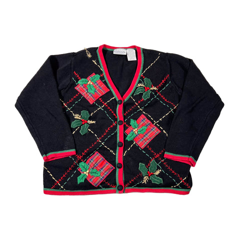 Black cardigan with Christmas-themed patterns on a white background