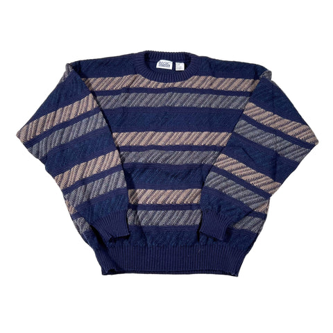 Navy and beige striped sweater on a white background